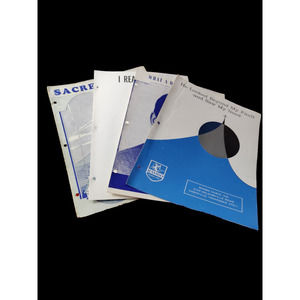 Bundle of sheet music and a music book
